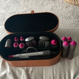 Gently used Dyson air wrap with all attachments + 4 long barrels.